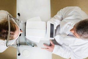 eye doctor performing comprehensive eye exam near you
